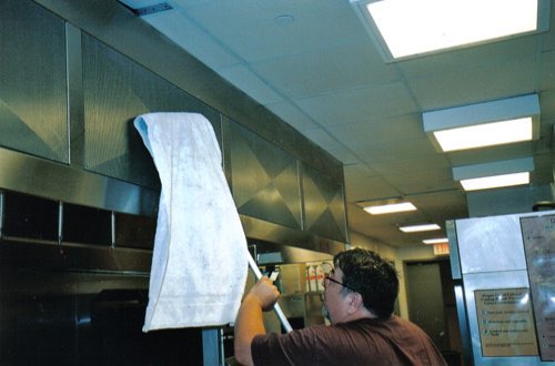 Polishing a steel hood.